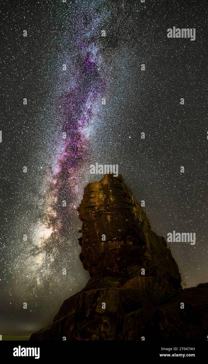 Beautiful and colorful Galaxy Milky Way over the 'Großer Gegenstein' at night in Germany, Ballenstedt Stock Photo