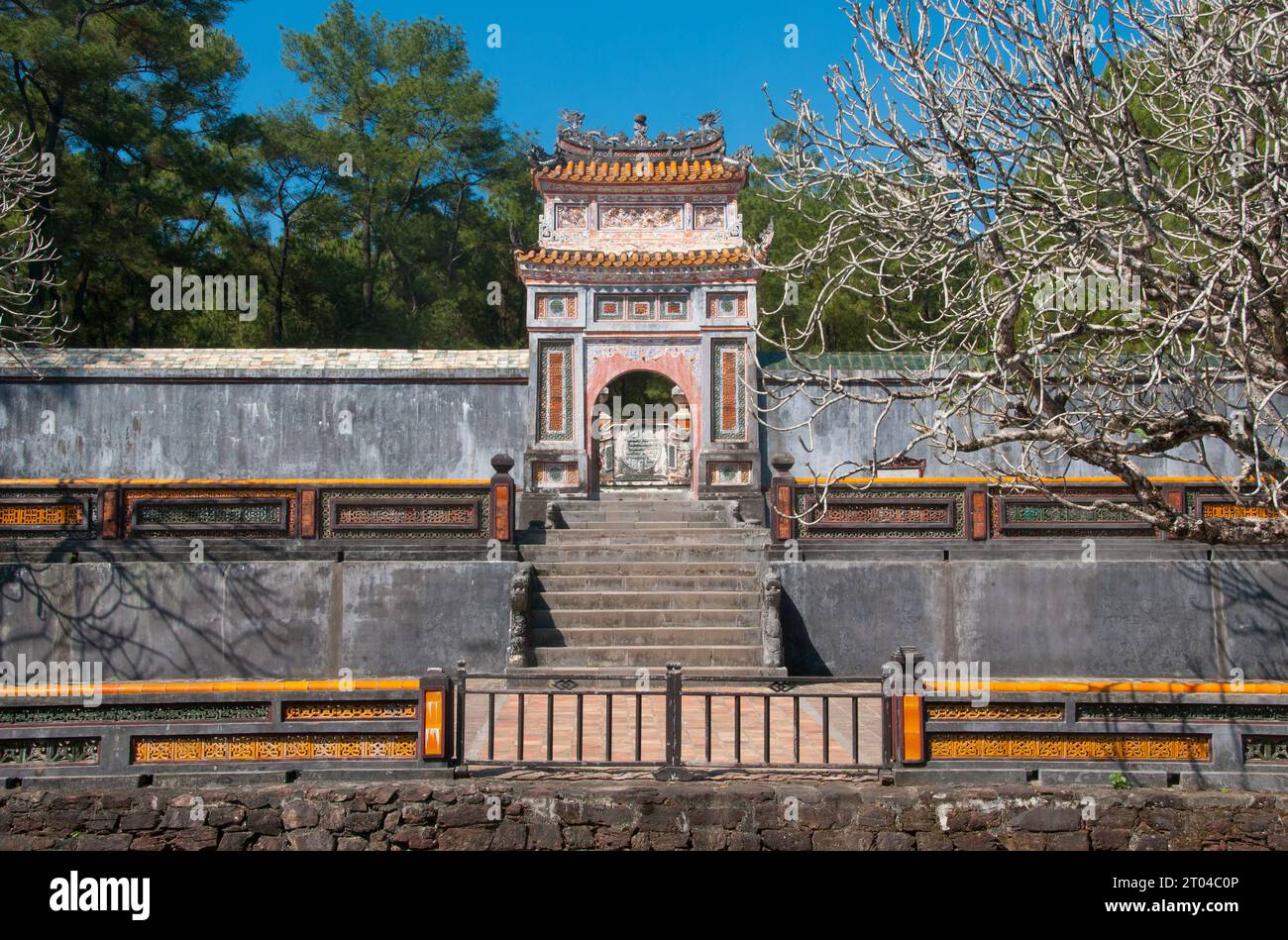 Vietnam: Gateway leading to the Tomb of Emperor Tu Duc, Hue. Emperor Tự Đức (22 September 1829 – 17 July 1883) (full name: Nguyễn Phúc Hồng Nhậm, also Nguyen Phuc Thi) was the fourth emperor of the Nguyễn Dynasty of Vietnam and reigned from 1847–1883.  The son of Emperor Thiệu Trị, Prince Nguyễn Phúc Hồng Nhậm succeeded his father on the throne, with the reigning title of Tự Đức, but family troubles caused his era to have a violent start. Thiệu Trị had passed over his more moderate eldest son, Hồng Bảo, to give the throne to Tự Đức. Stock Photo