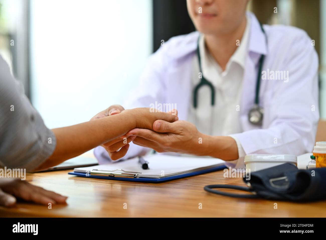 Measuring Caring Hands male physician measuring blood hi-res stock photography and ...