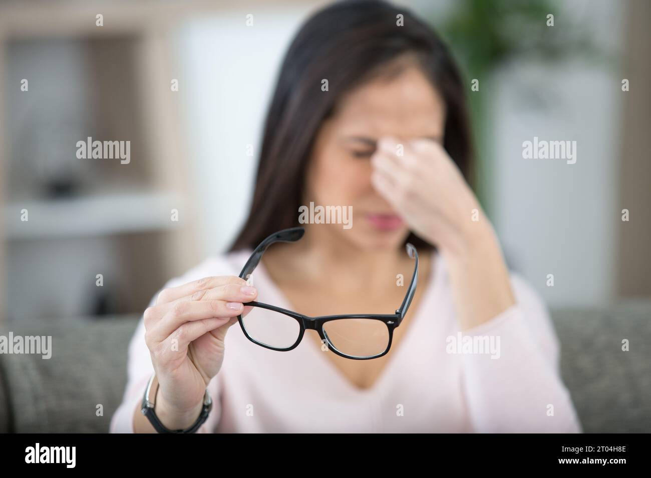 tired minded woman thinking about way to complete task Stock Photo