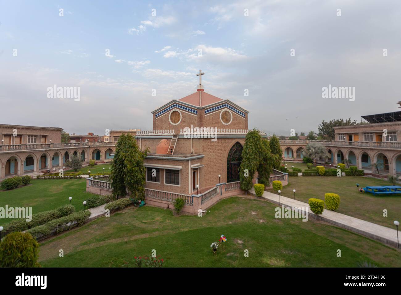 The picture of Renewal Center Lahore captures an exquisite blend of stunning architecture and lush greenery, creating a harmonious oasis. Stock Photo