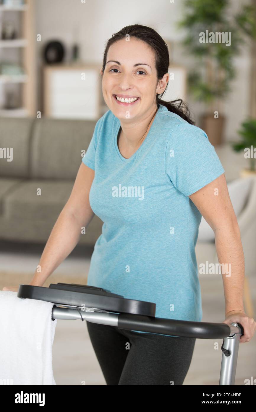 young fit woman practicing at home Stock Photo