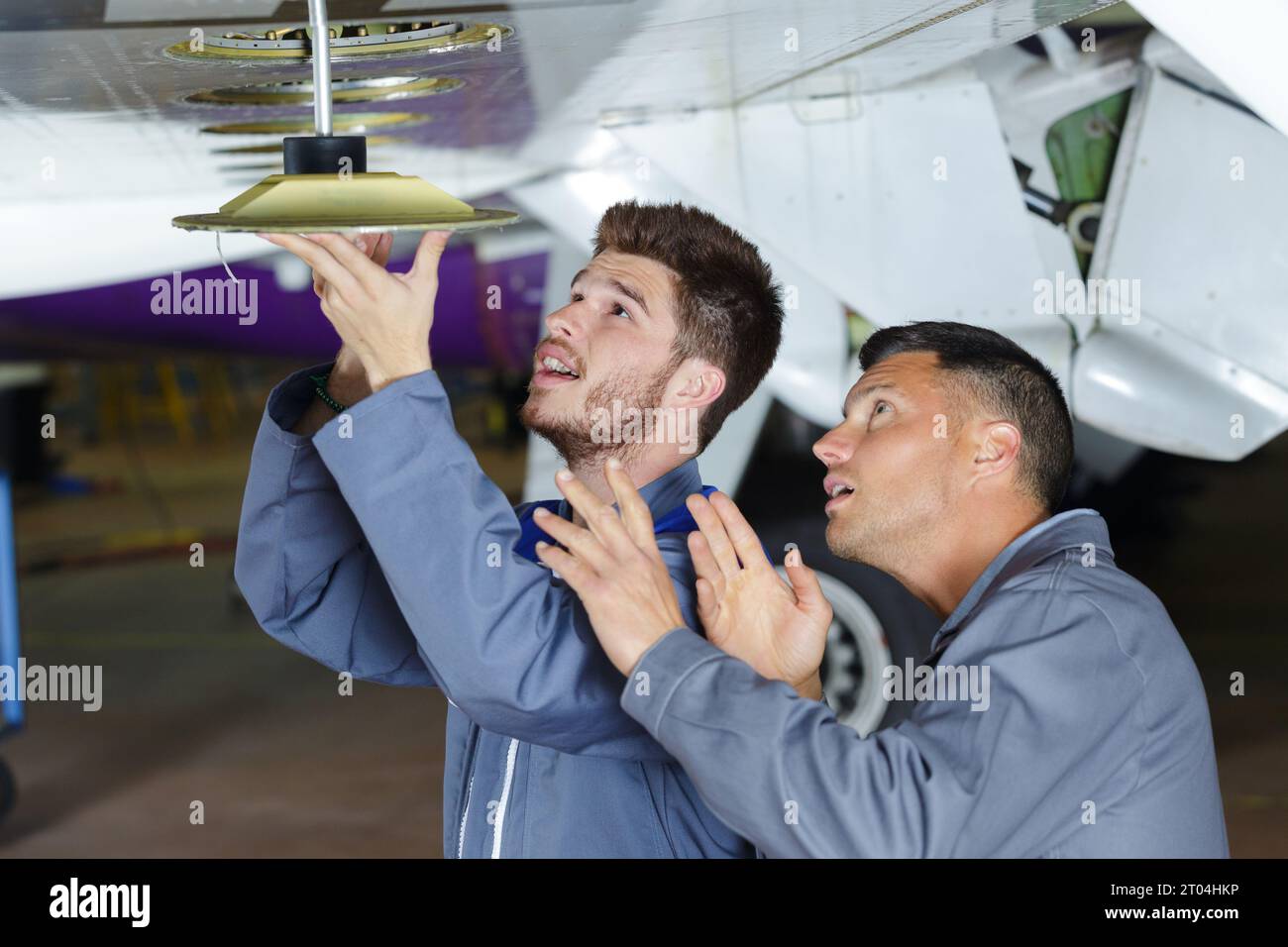 technicians engineers checking the turbine engines airplane Stock Photo ...