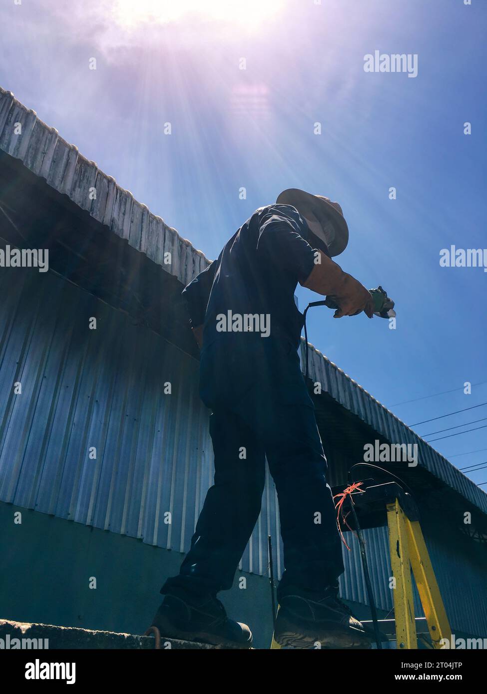 Cutting Metal, Man with cutting steel tool blurred background ...