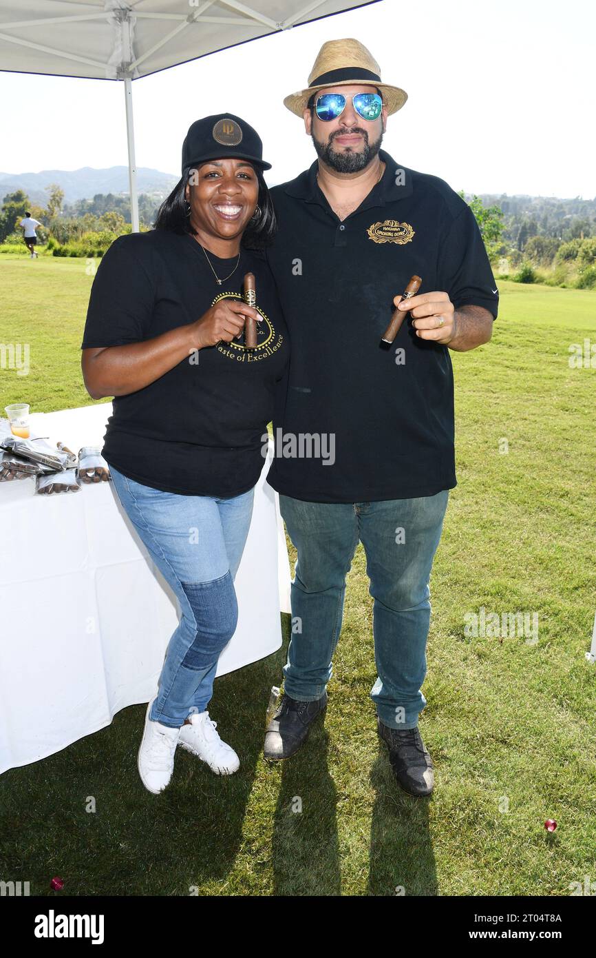 TARZANA, CALIFORNIA - OCTOBER 02: (L-R) Ramona Burns and Raoul Reyner attend the Music Forward Foundation Golf Classic at El Caballero Country Club on Stock Photo