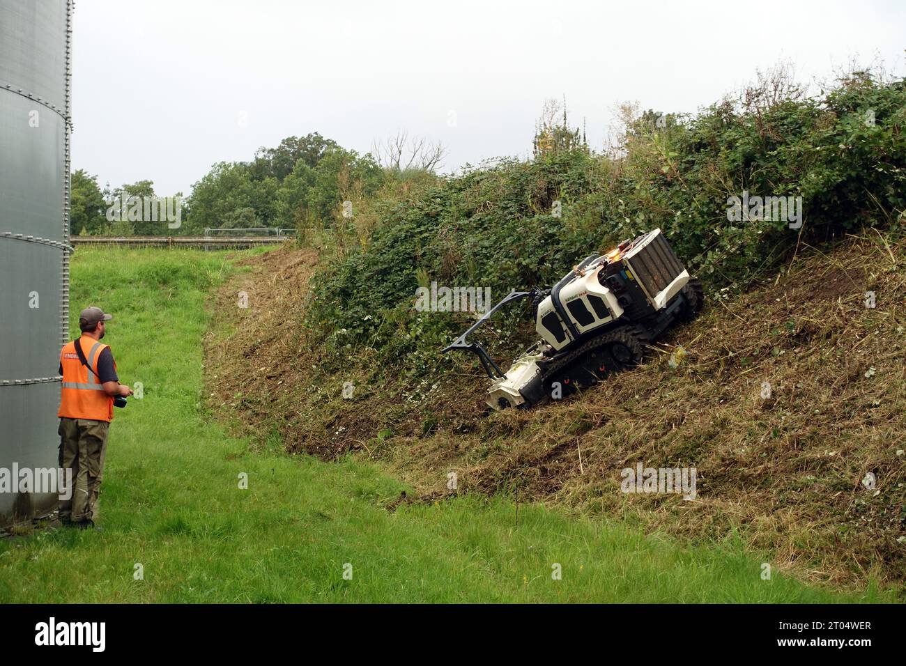remote controlled embankment mower at work Stock Photo