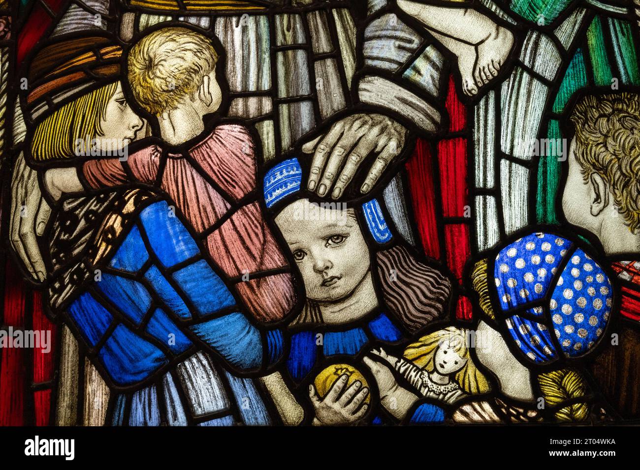 Detail from a stained glass window designed by Robert Anning Bell (1863-1933); children with Jesus. Stock Photo