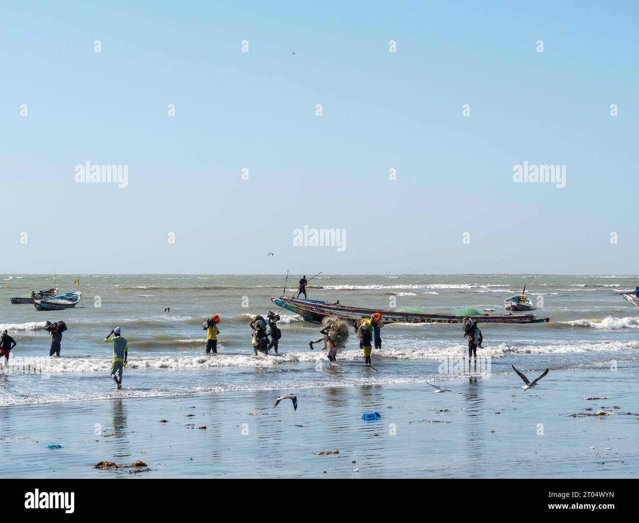 Fisherman at work on the beach in the Gambia, Gambia Stock Photo
