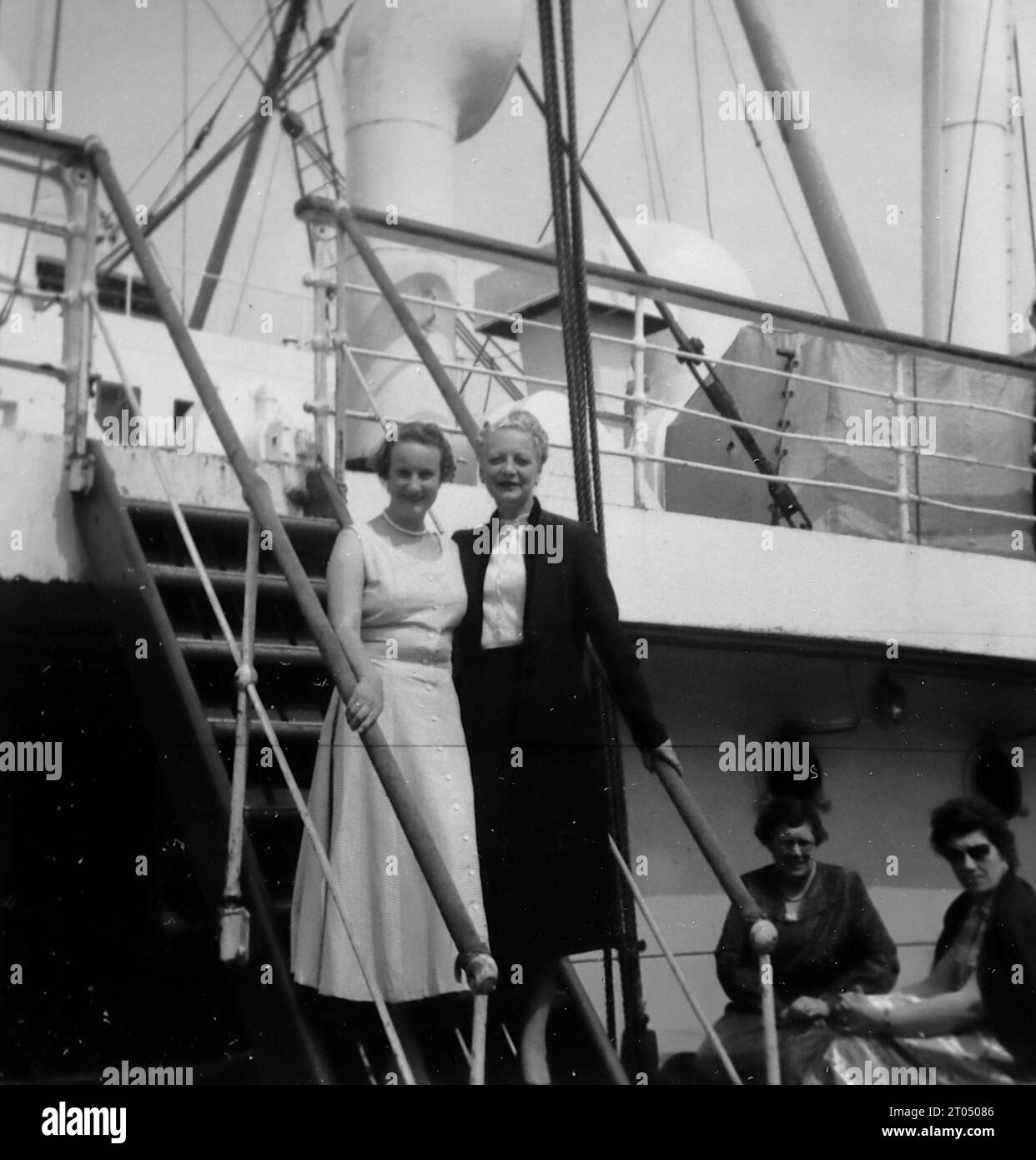 Passengers descending a stairway upon arrival in New York. This photograph is from an unattributed personal album of photographs of a cruise to New York dated 29th June to 13th August 1956. Sailing from Liverpool aboard the Cunard vessel M.V. Britannic and returning from New York to Southampton aboard the Cunard vessel R.M.S. Queen Mary. Average size of the original photographs was 4x3 inches. Stock Photo