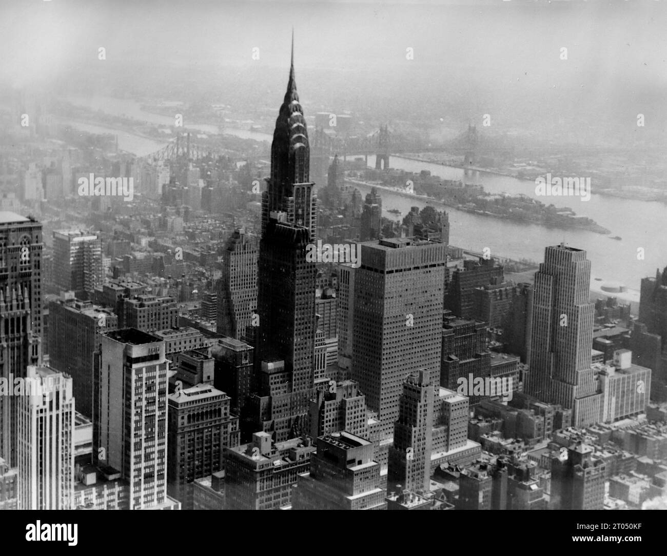 A view from the Empire State Building including the Chrysler Building. This photograph is from an unattributed personal album of photographs of a cruise to New York dated 29th June to 13th August 1956. Sailing from Liverpool aboard the Cunard vessel M.V. Britannic and returning from New York to Southampton aboard the Cunard vessel R.M.S. Queen Mary. Average size of the original photographs was 4x3 inches. Stock Photo
