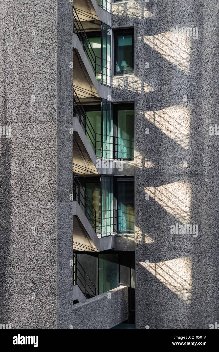 Concrete stairs casting shadow, forming a interesting geometric shape Stock Photo