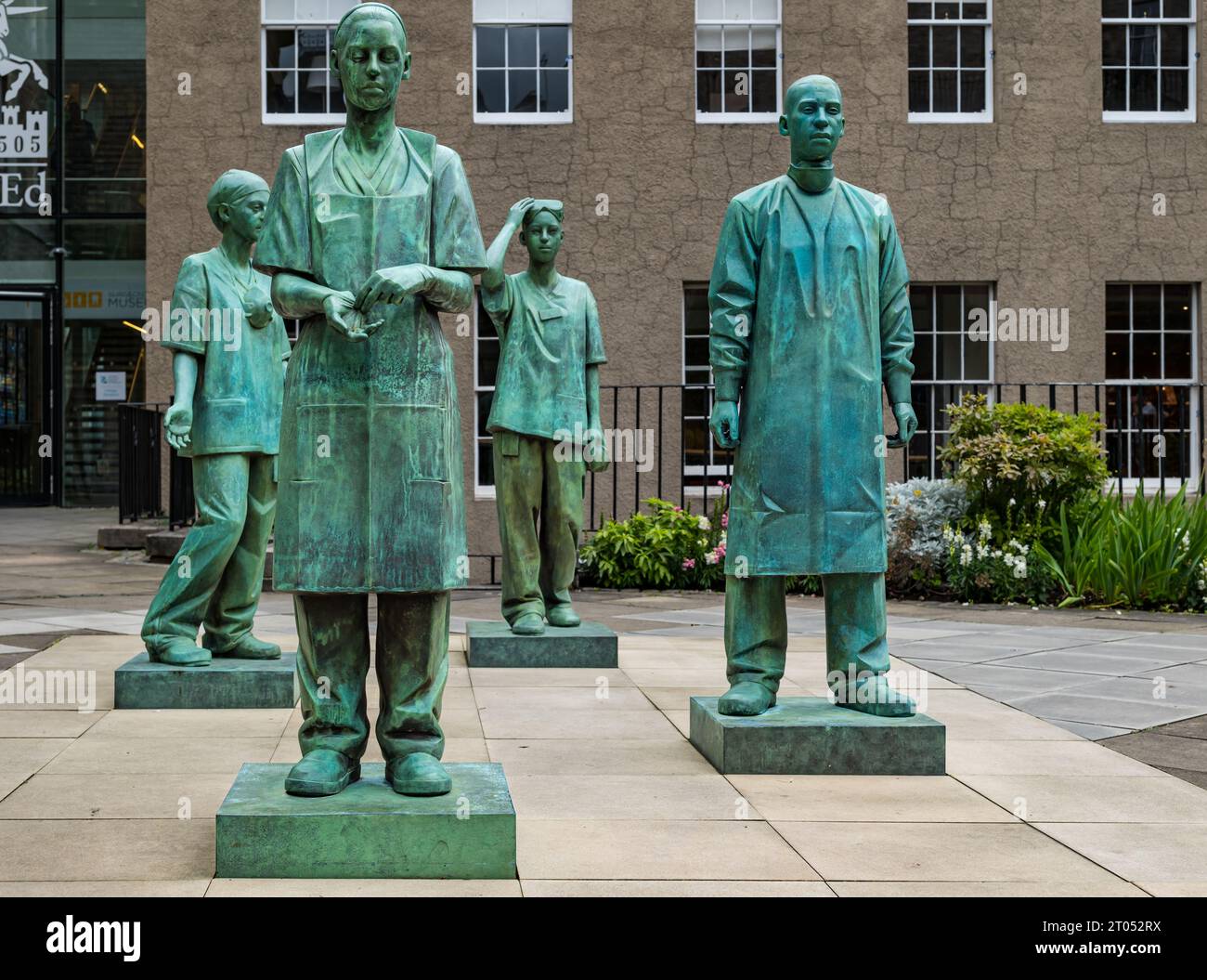 Bronze memorial statues of NHS medical and nursing staff during Covid-19 by sculptor Kenny Hunter, Royal College of Surgeons, Edinburgh, Scotland, UK Stock Photo