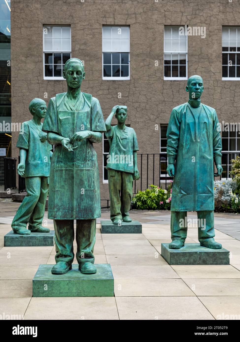 Bronze memorial statues of NHS medical and nursing staff during Covid-19 by sculptor Kenny Hunter, Royal College of Surgeons, Edinburgh, Scotland, UK Stock Photo