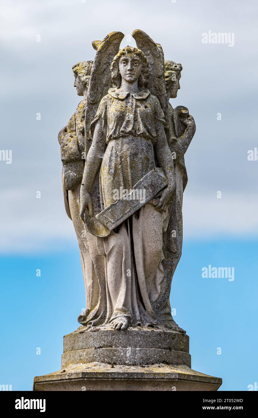 Religious stone statue of three angels, East Saltoun village, East
