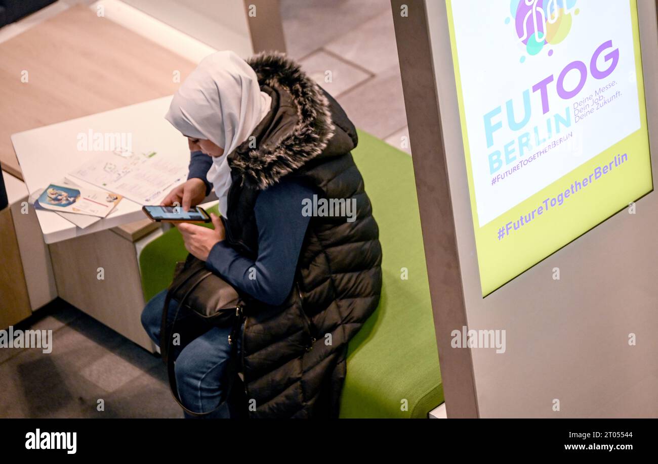 Berlin, Germany. 04th Oct, 2023. A visitor gets information at the job