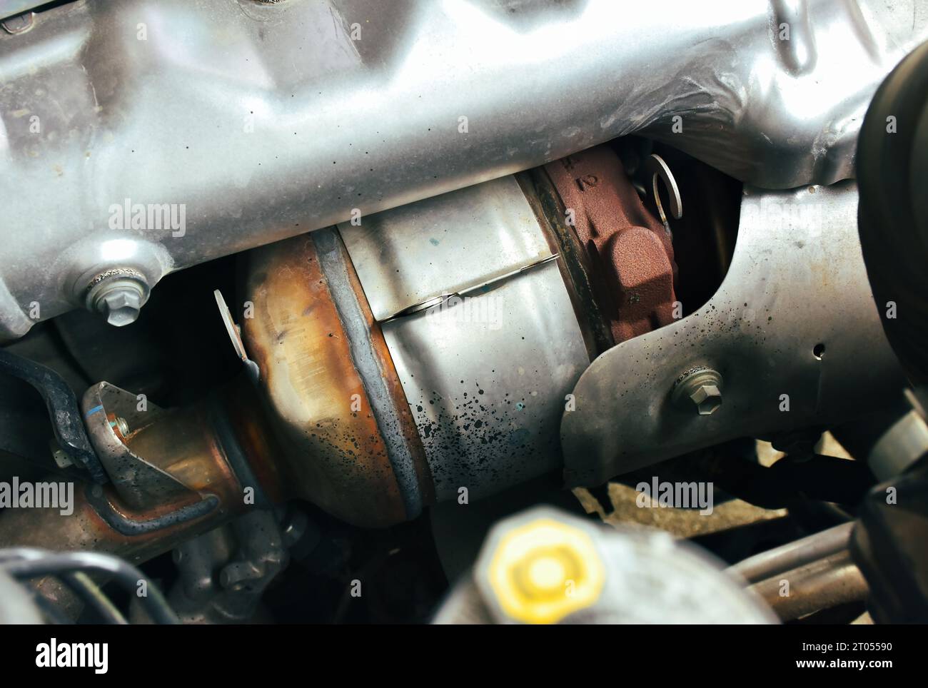 Catalytic converter on diesel engine in a car, close up a car catalytic