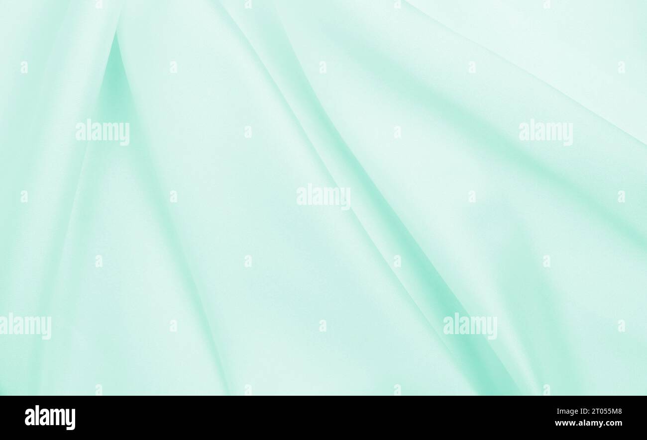 Smooth elegant green silk or satin luxury cloth texture can use as ...