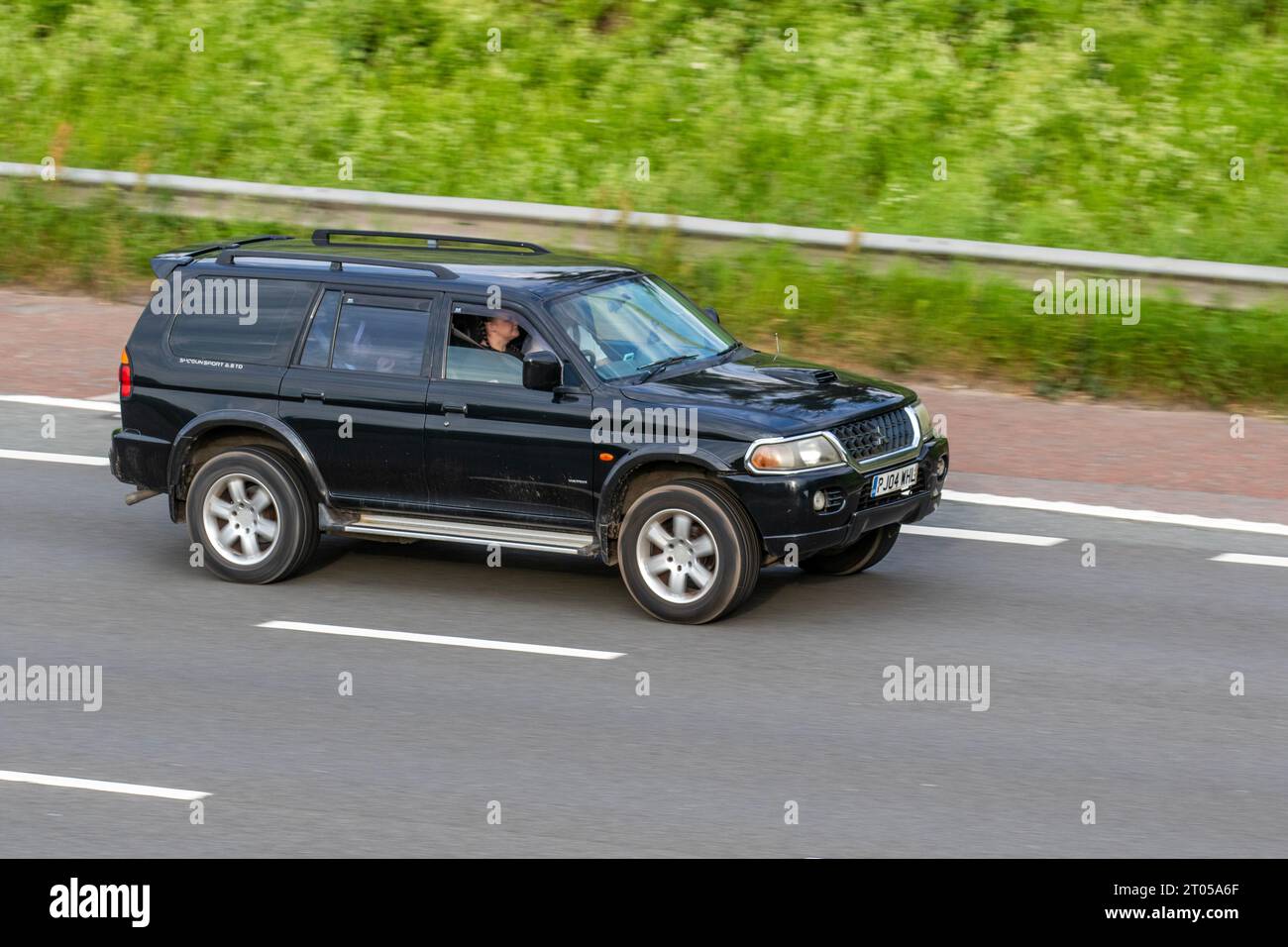 2004 Mitsubishi Shogun Sport TD Warrior 2477cc 5-speed manual; travelling at speed on the M6 motorway in Greater Manchester, UK Stock Photo