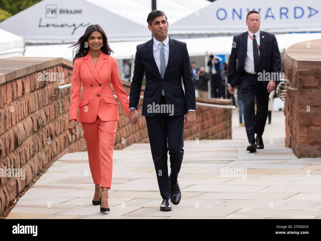 Manchester, UK. 04th Oct, 2023 The PM Rishi Sunak and wife,Akshata Murthy, walk from the Midland Hotel to the Manchester Conference centre where he gave the speech introduced by his wife Akshata Murthy. Manchester UK. Credit: GaryRobertsphotography/Alamy Live News Credit: GaryRobertsphotography/Alamy Live News Stock Photo