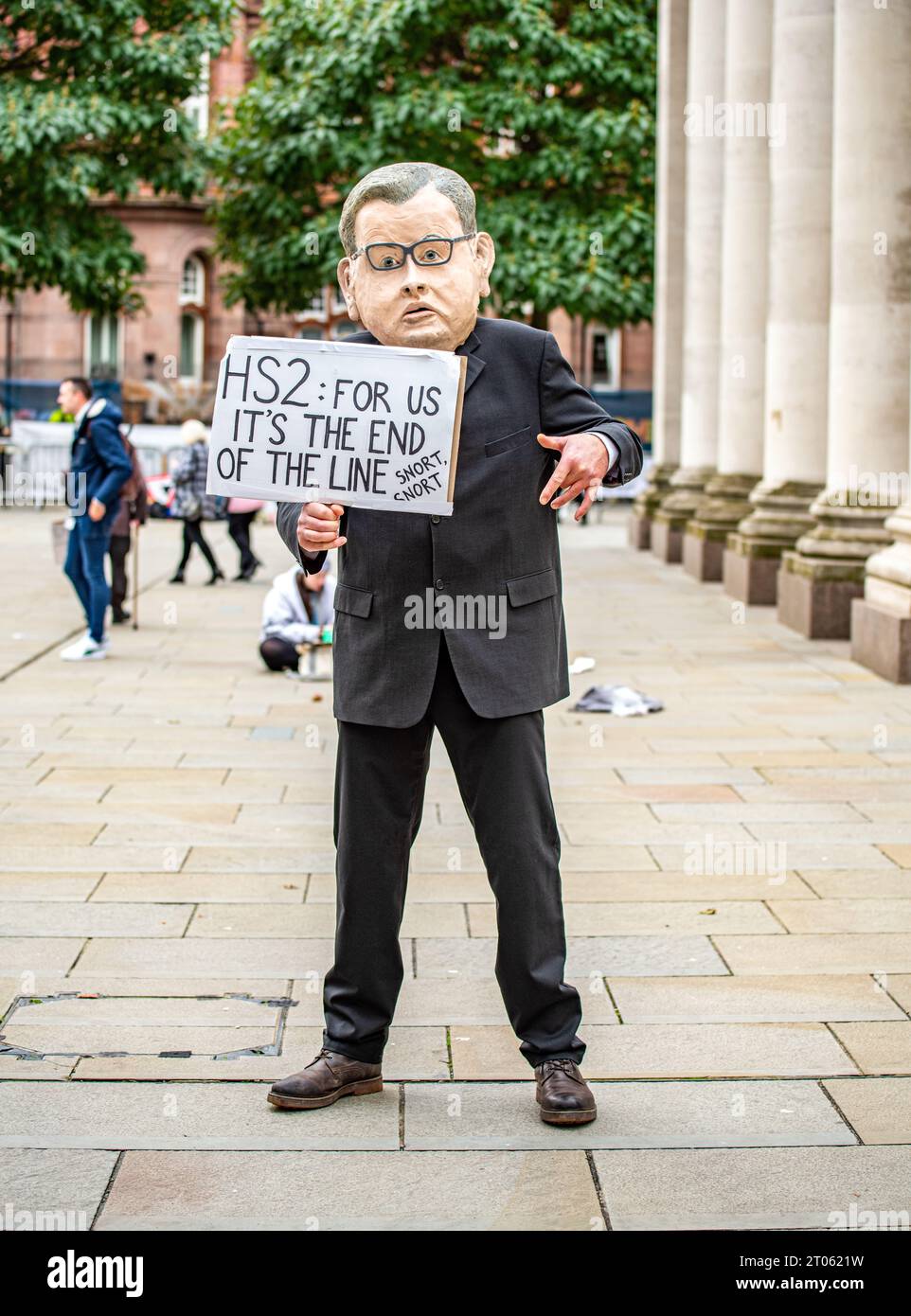 A protester in a parody mask mocking HS2 MANCHESTER, ENGLAND DIVISIVE IMAGES show the intense atmosphere surrounding the Conservative Conference in Ma Stock Photo