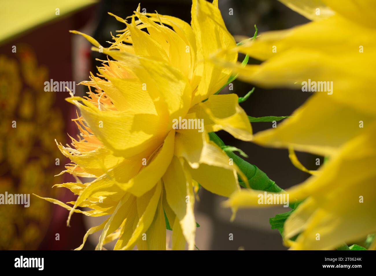 Paper sunflower. Yellow flower in sun. Paper flower. Decorative paper. Stock Photo