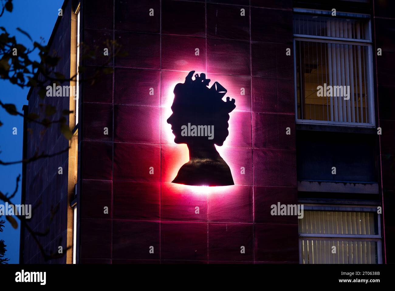 Queen Elizabeth illuminated profile on Jubilee House, Kenilworth, Warwickshire, England, UK
