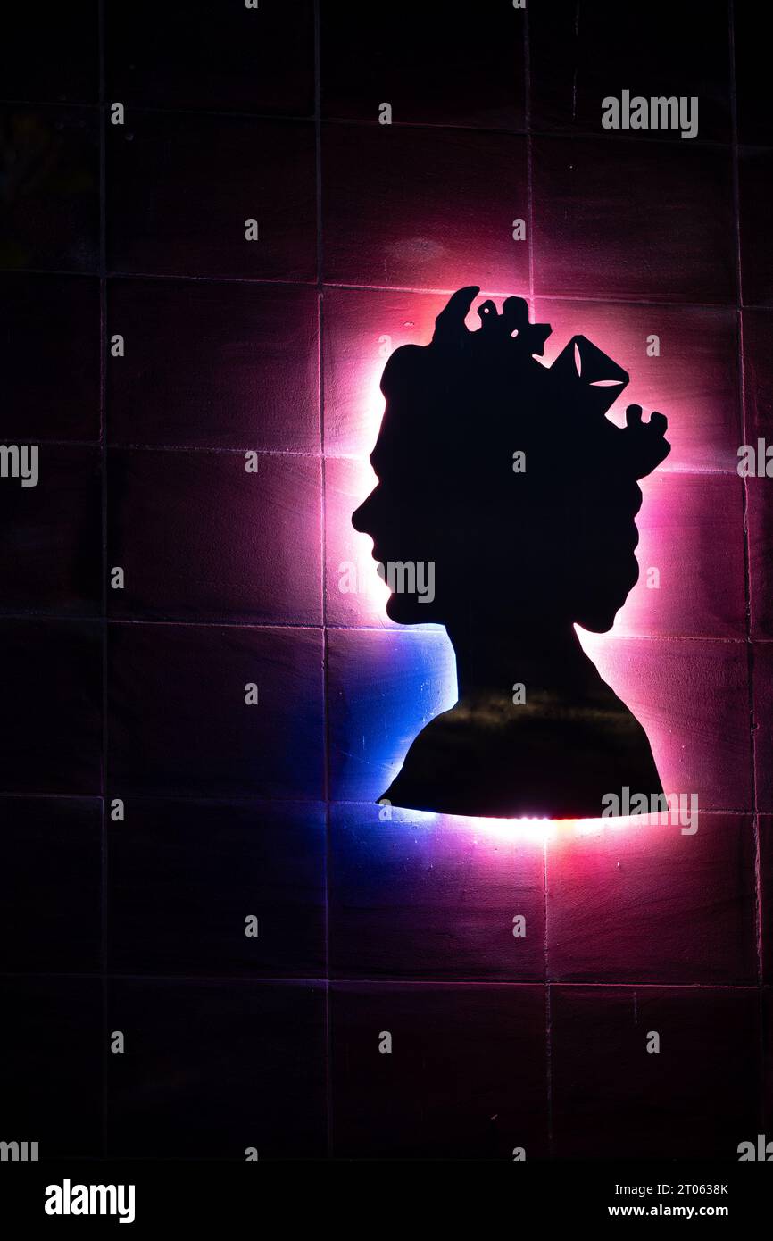 Queen Elizabeth illuminated profile on Jubilee House, Kenilworth, Warwickshire, England, UK