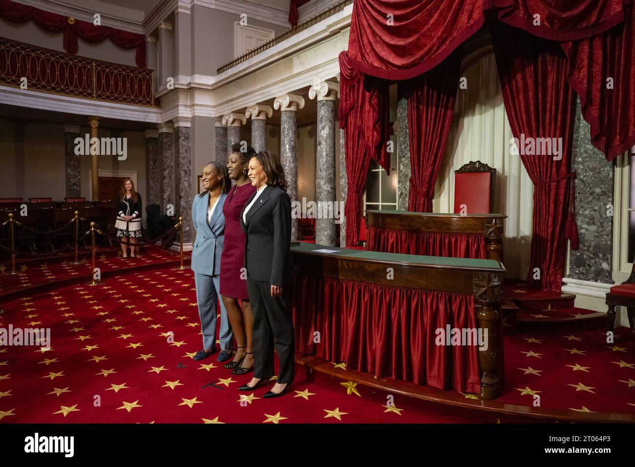 Laphonza Butler, DCA, left, takes a photo with her wife Neneki Lee and