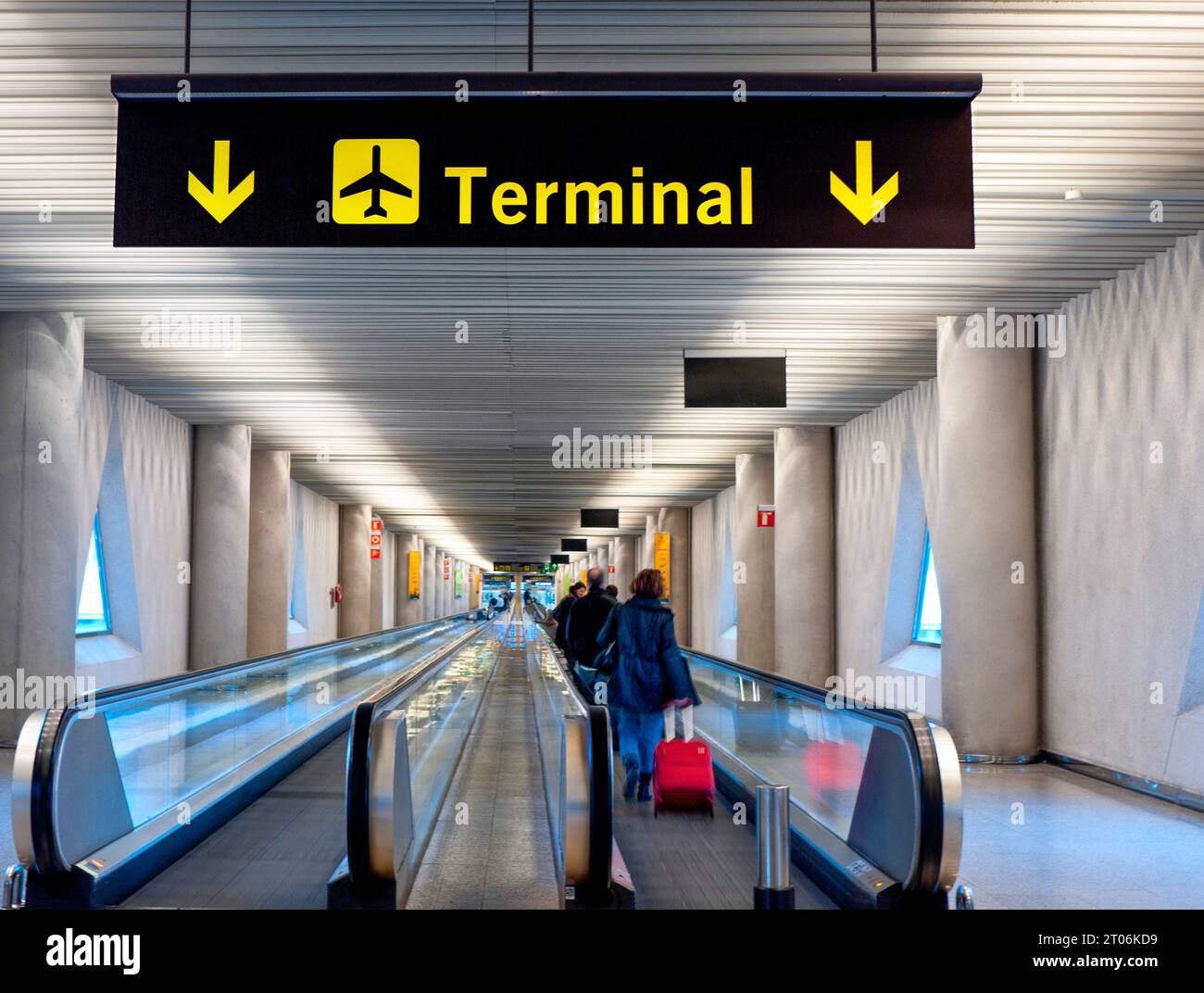 AIRPORT TERMINAL DEPARTURES ENTRANCE SIGN BOARD  Airline passengers moving walkway into modern contemporary airport terminal. Palma Spain Mallorca Stock Photo