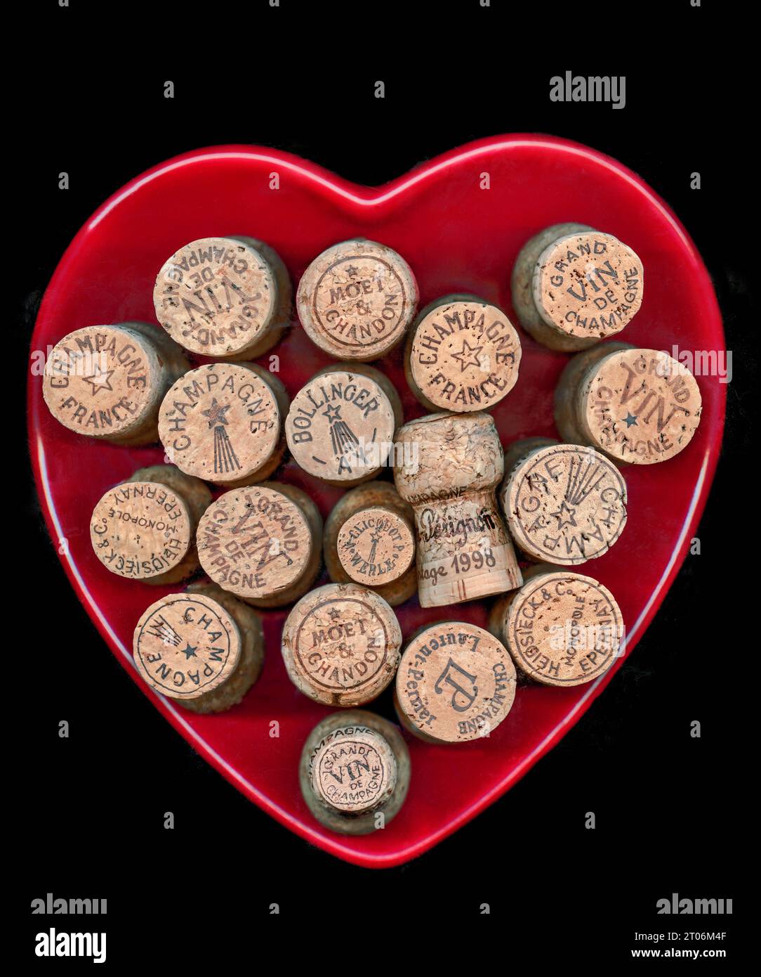 French fine champagne corks including Dom Perignon, Bollinger, Heidsieck ,Veuve Clicquot and Moet Chandon, in a heart shaped dish France Stock Photo