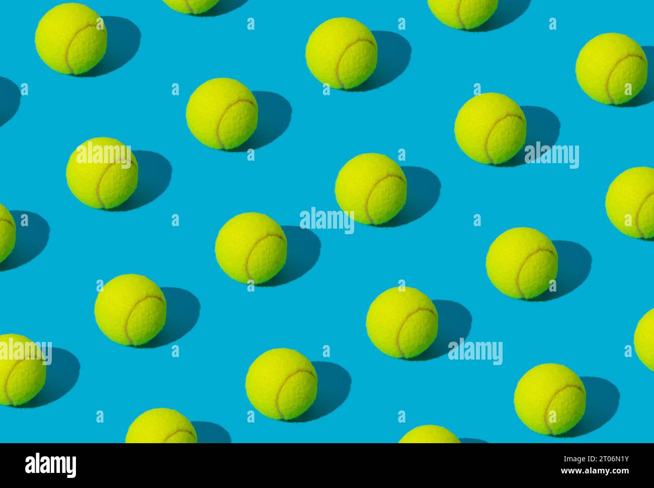 Trendy tennis ball pattern on light blue background. Minimal sport concept. Creative tennis ball