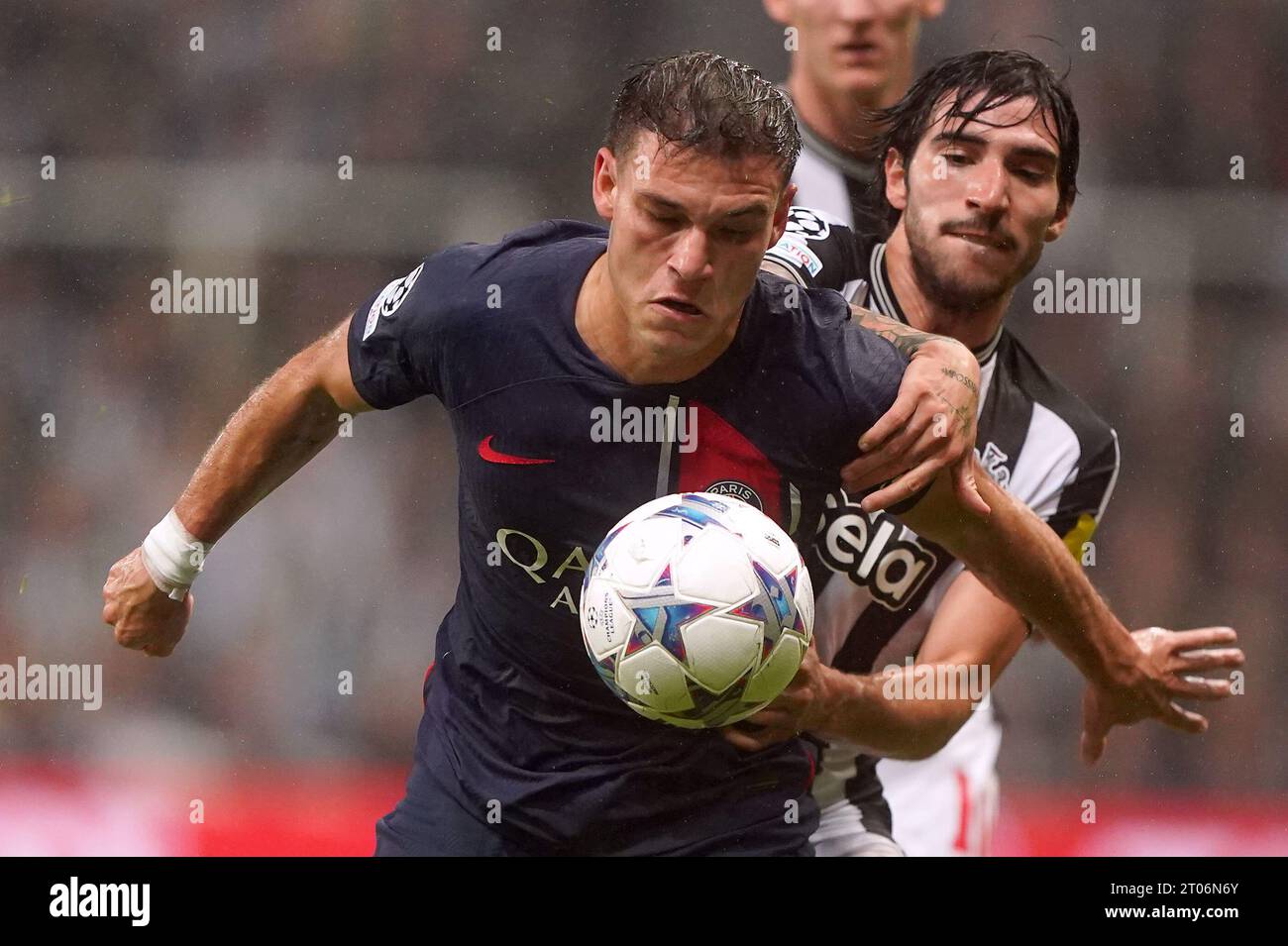 Paris Saint-Germain's Manuel Ugarte and Newcastle United's Sandro Tonali (right) battle for the ball during the UEFA Champions League Group F match at St. James' Park, Newcastle upon Tyne. Picture date: Wednesday October 4, 2023. Stock Photo