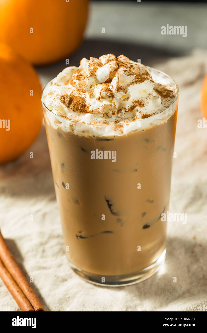 Cold Refreshing Iced Pumpkin Spice Latte with Whipped Cream Stock Photo