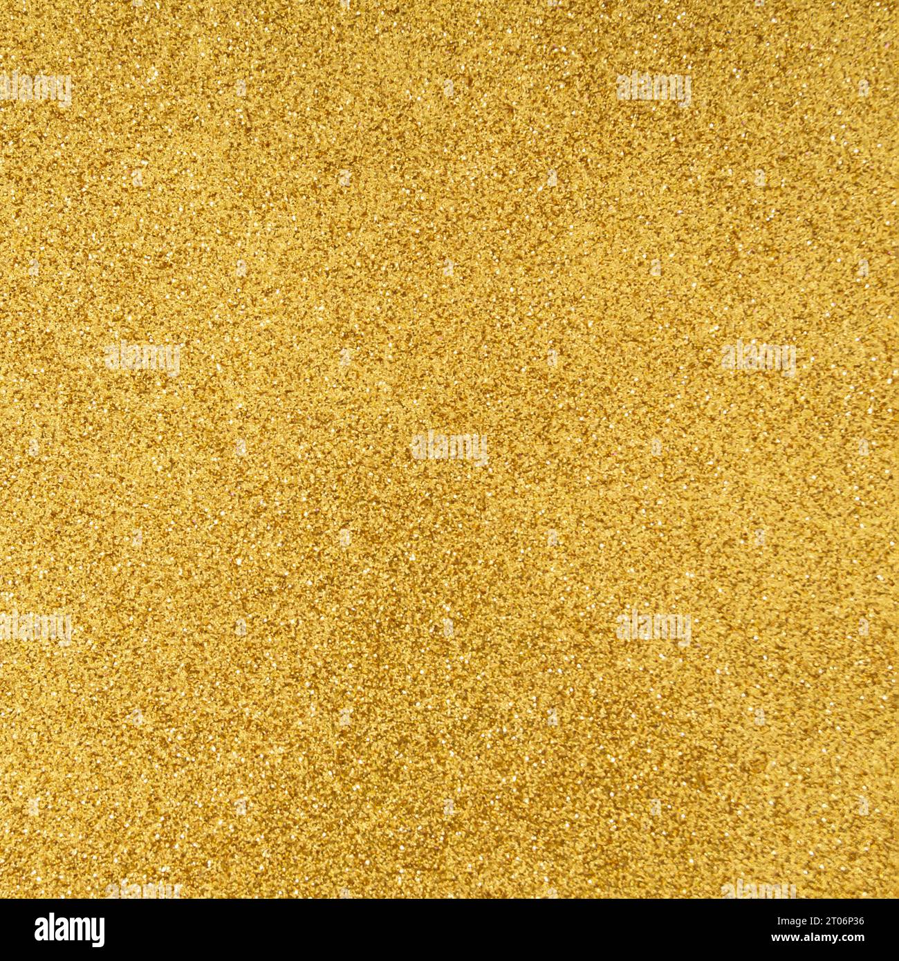 Trendy sparkly golden glitter texture background. Minimal background concept. Creative texture background idea. Flat lay, top of view. Stock Photo