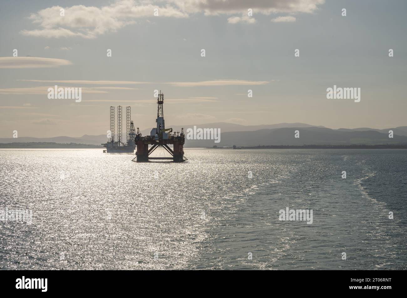 Inverness Rigs Oil Platform and offshore wind turbine installation ship in the bay of ...