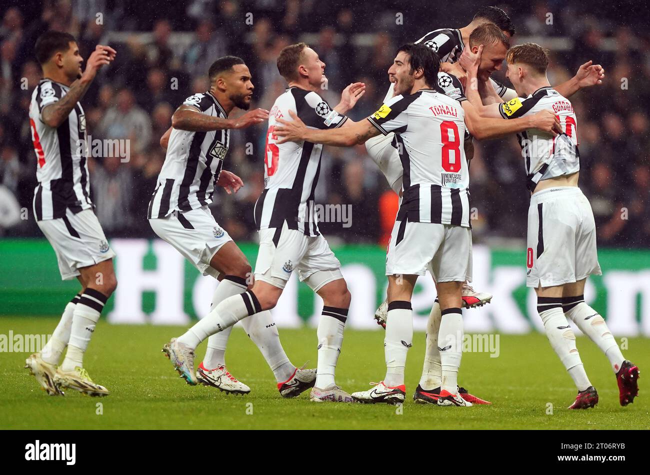 Newcastle United's Dan Burn celebrates scoring their side's second goal of the game with team-mates during the UEFA Champions League Group F match at St. James' Park, Newcastle upon Tyne. Picture date: Wednesday October 4, 2023. Stock Photo