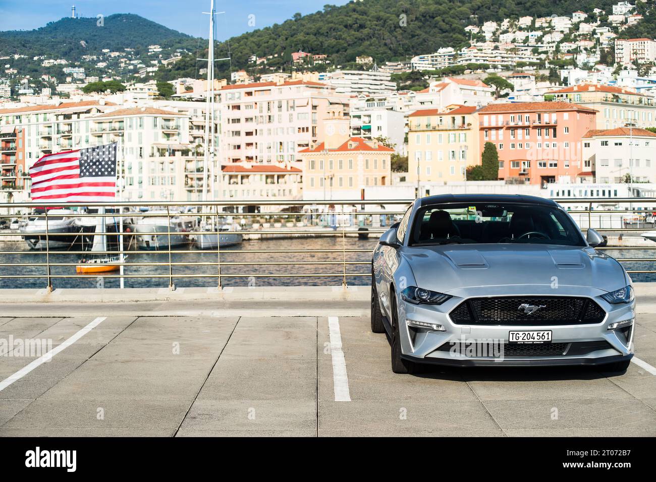 Nice, France - 10 03 2023 : Ford Mustang GT sports car and American flag in Nice old port Stock Photo