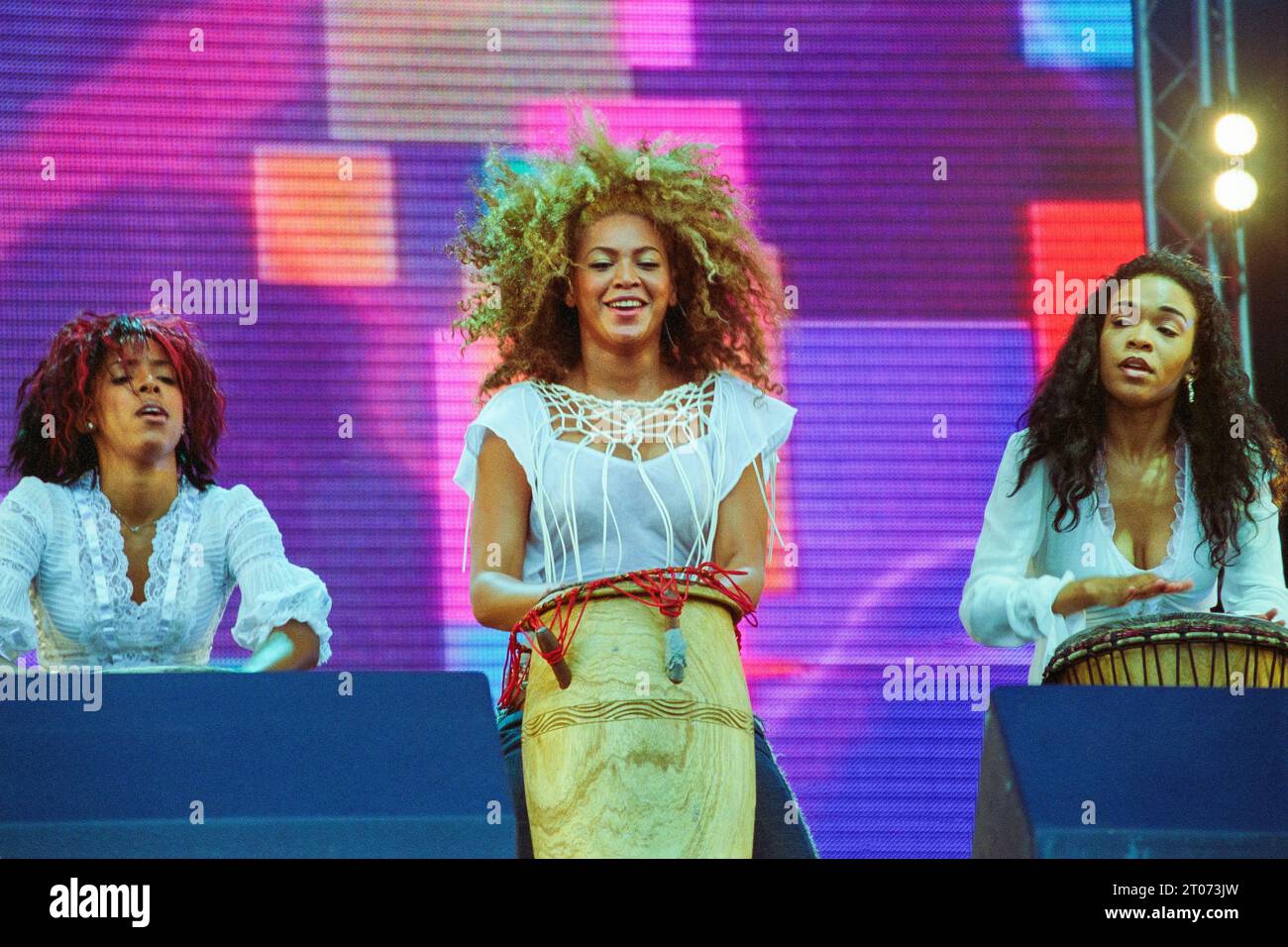 Kelly Rowland, Beyonce Knowles and Michelle Williams of Destiny's Child playing live at Radio 1 One Big Sunday at Morfa Stadium in Swansea on 16 June 2002. Photograph: Rob Watkins. Stock Photo