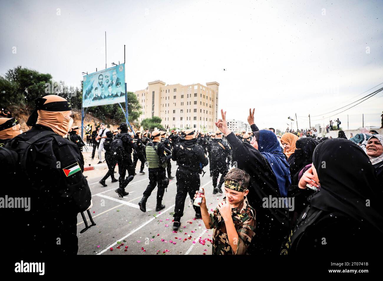 Gaza, Palestine. 04th Oct, 2023. A woman cheers as Palestinian militants of the Islamic Jihad movement march during an anti-Israel military parade marking the 36th anniversary of the movement's foundation in Gaza City Credit: SOPA Images Limited/Alamy Live News Stock Photo