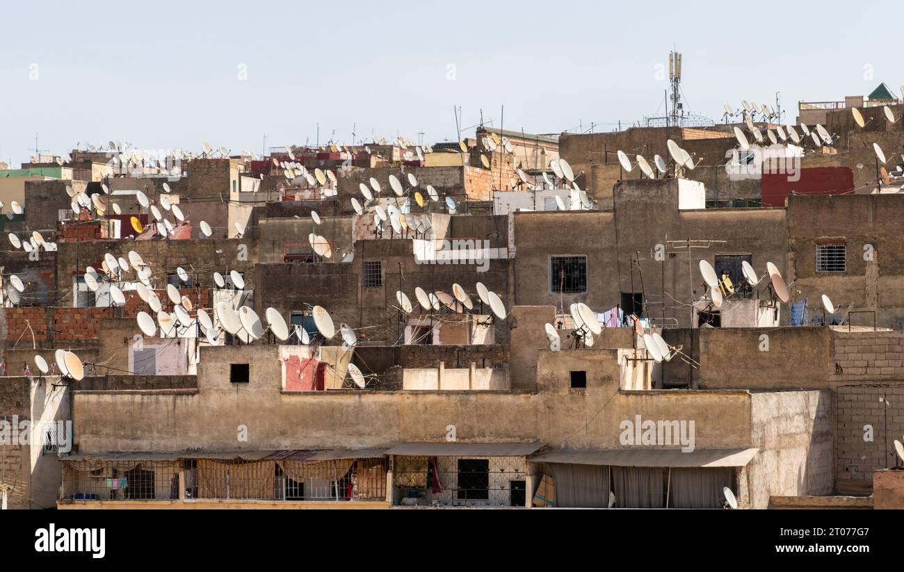 Buildings with many satellite dishes installed in Morocco. These dishes are used to receive television and other signals from satellites orbiting the Stock Photo