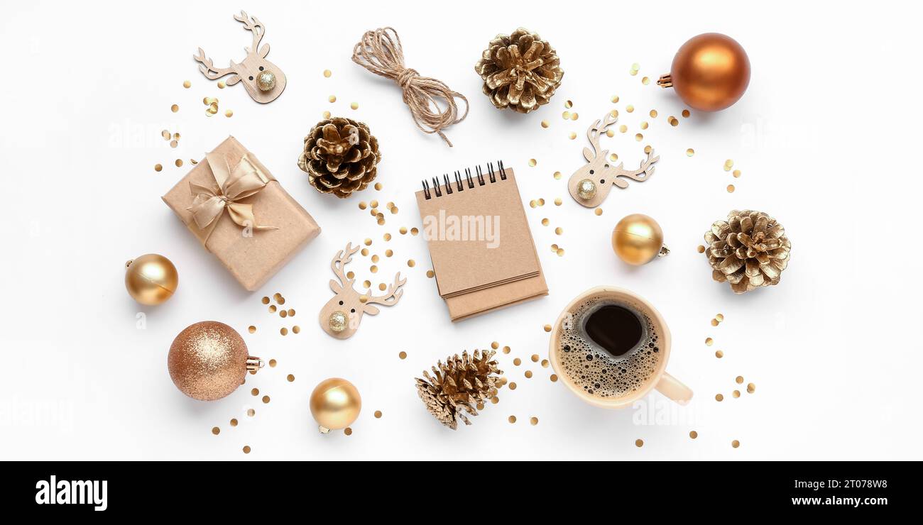 Blank paper calendar with gift, cup of coffee and Christmas decorations ...