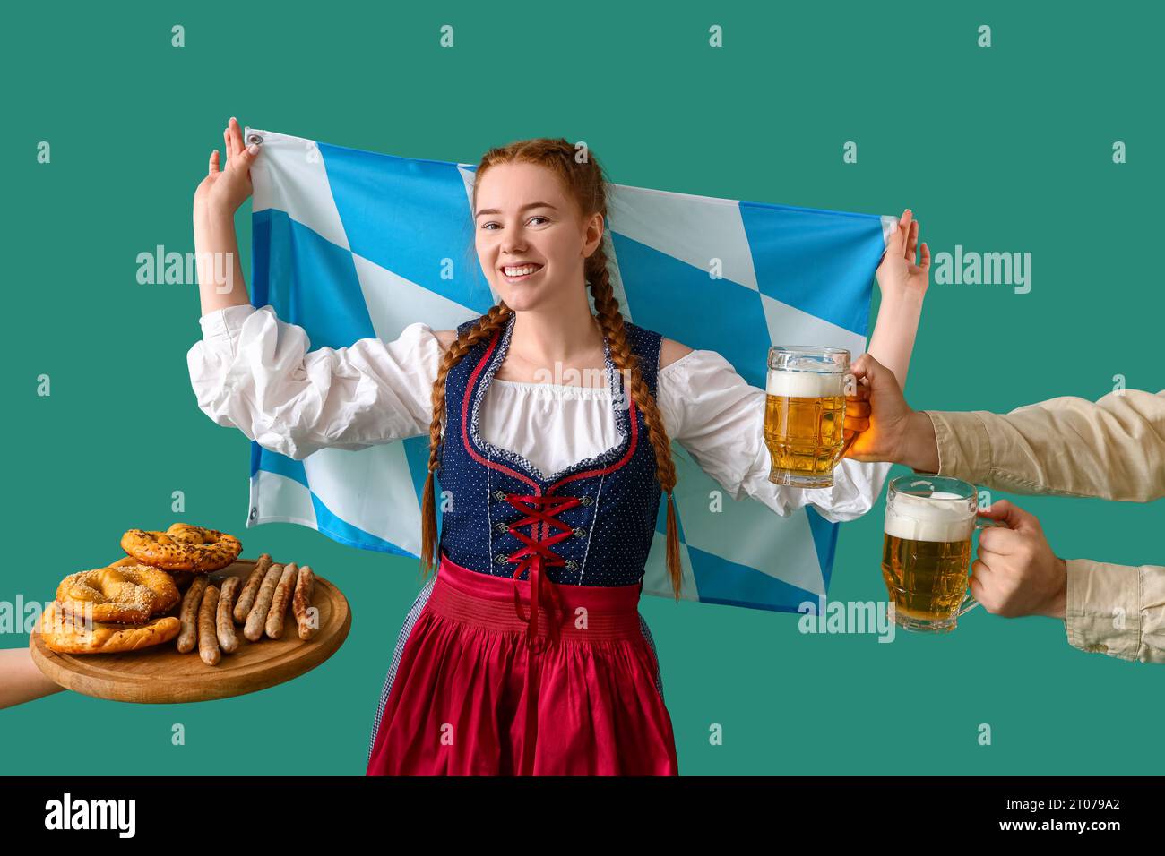Young woman in traditional German clothes with Bavarian flag receiving