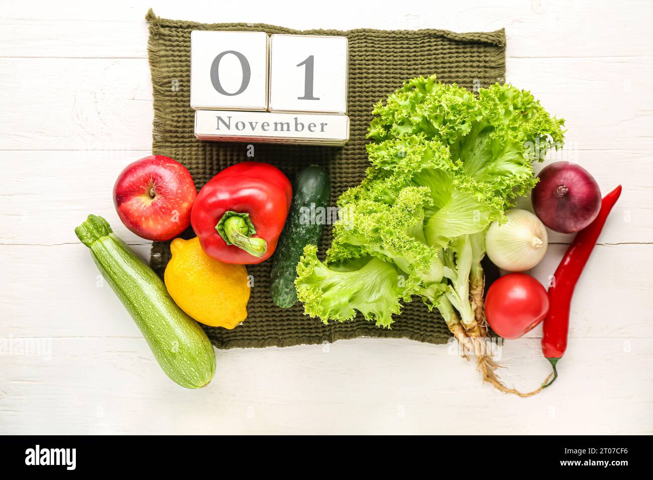 Fresh vegetables, fruits and cube calendar with date NOVEMBER 1 on
