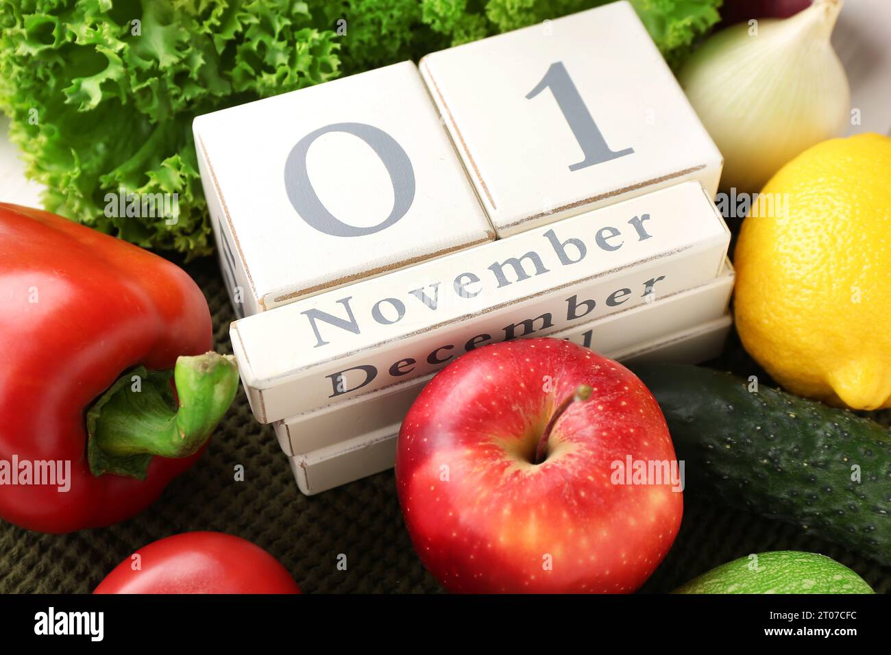 Nov Day Table Fresh vegetables, fruits and cube calendar with date NOVEMBER 1 on ...