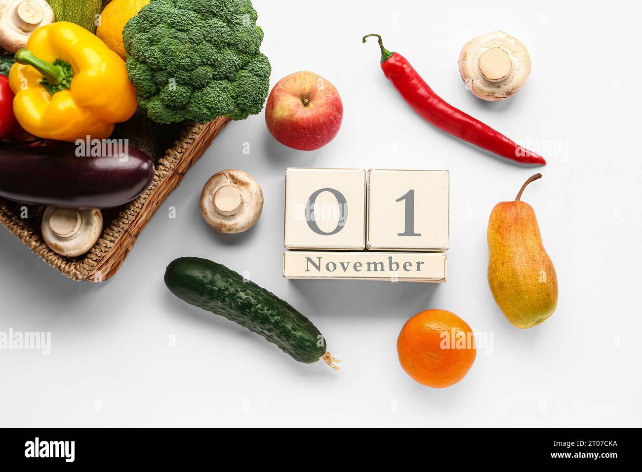 Fresh vegetables, fruits and cube calendar with date NOVEMBER 1 on