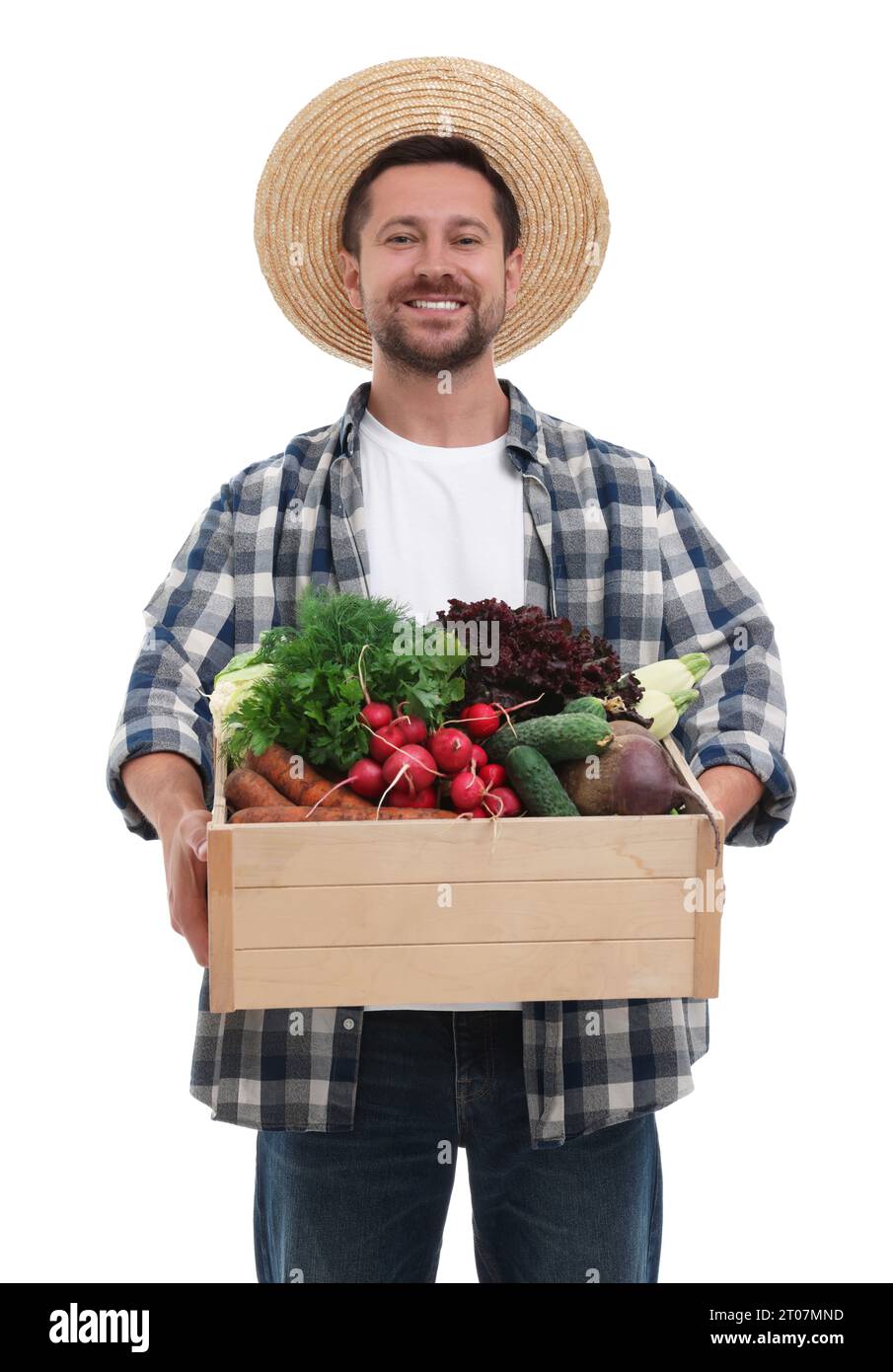 Harvesting season. Happy farmer holding wooden crate with vegetables on ...