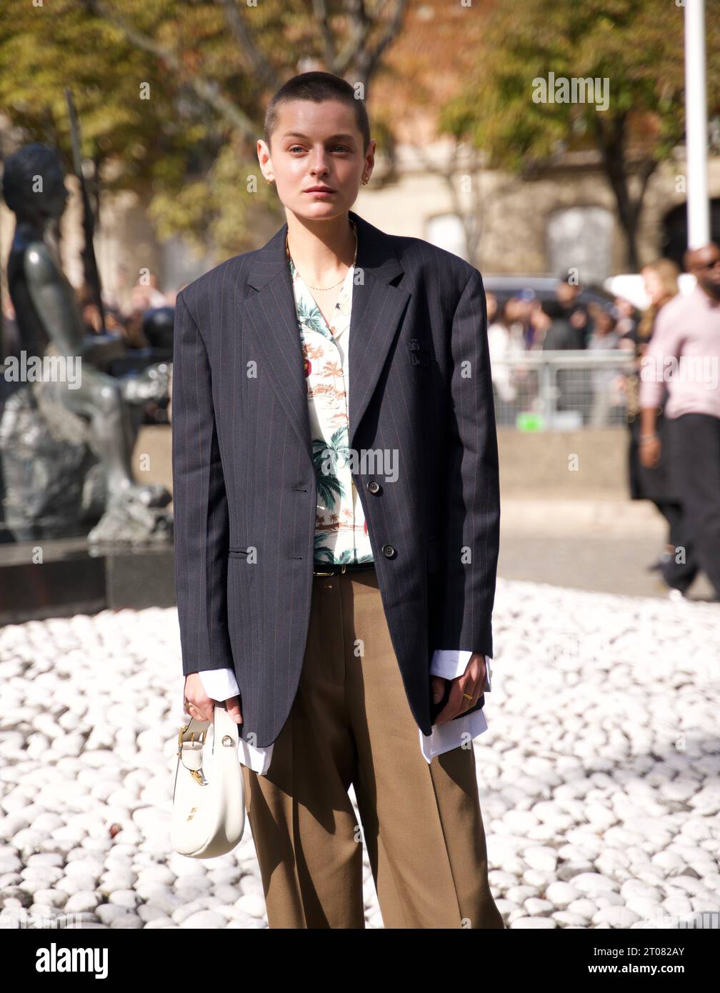 Emma Corrin Wears Bold Olive Green Cardigan and Briefs Look for Miu Miu in  Venice—See the Photos