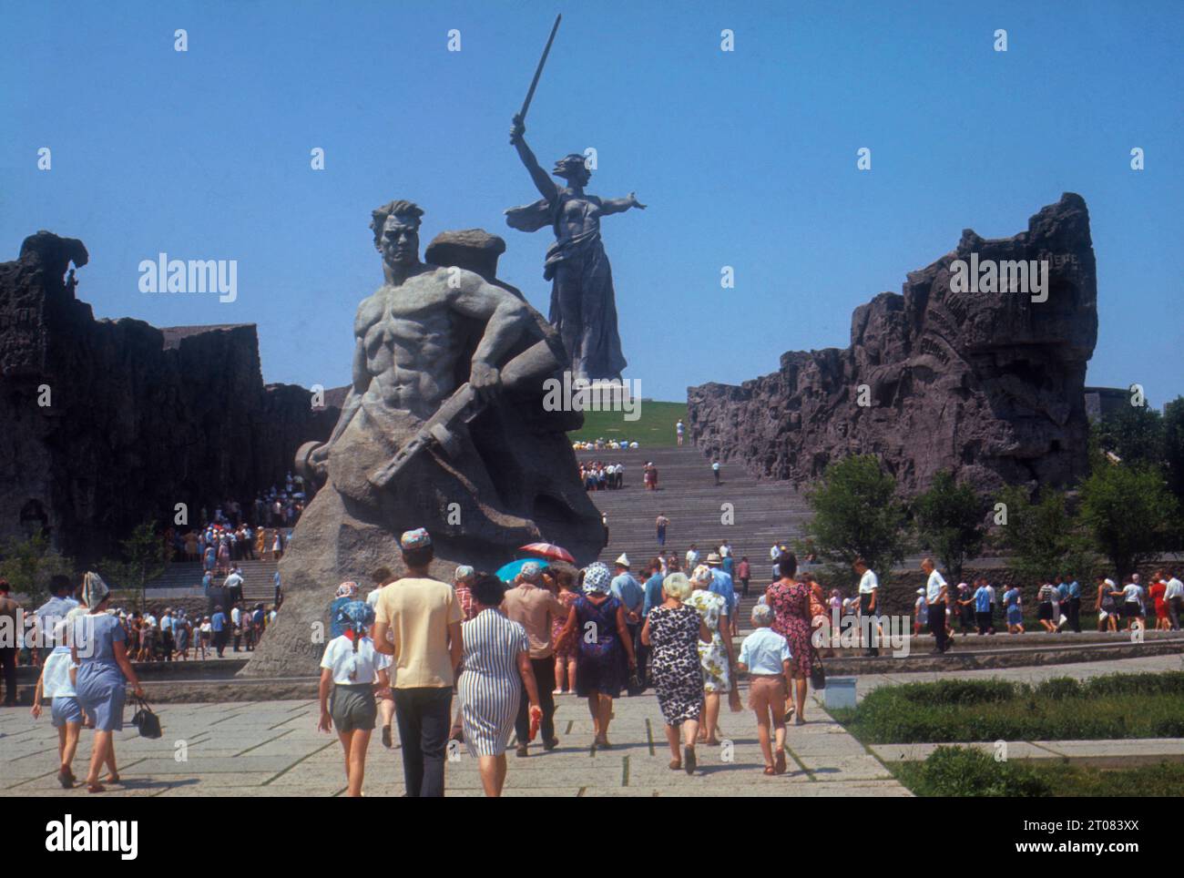 USSR. Volgograd. Memorial complex to the heroes of the Battle of Stalingrad on Mamayev Kurgan Hill. In front is a statue of a Russian soldier; on top of the hill is 'The Motherland Calls' statue. Stock Photo