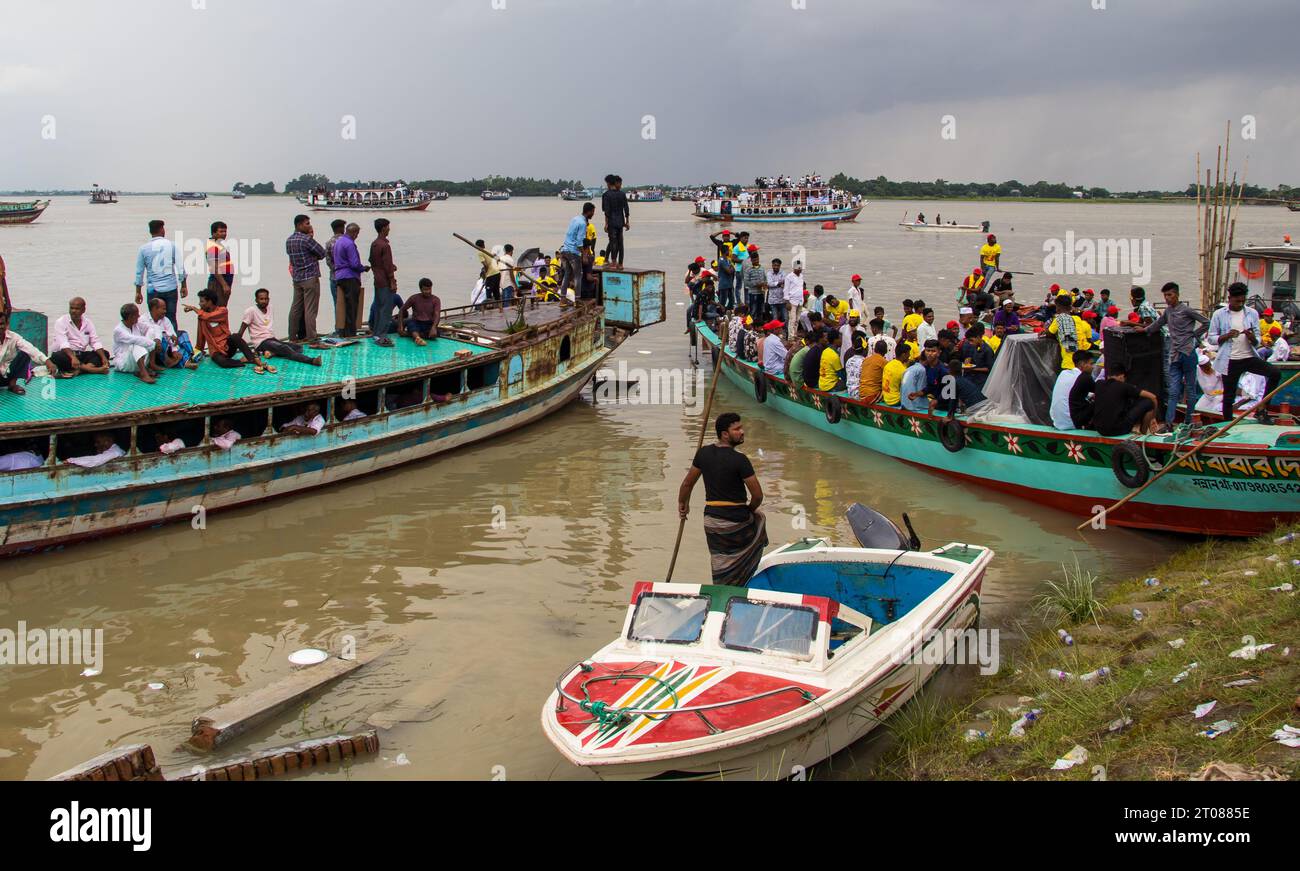 Traditional boat station, people's lifestyle, and cloudy sky photography captured on June 25, 2022, from Mawa boat station, Bangladesh Stock Photo