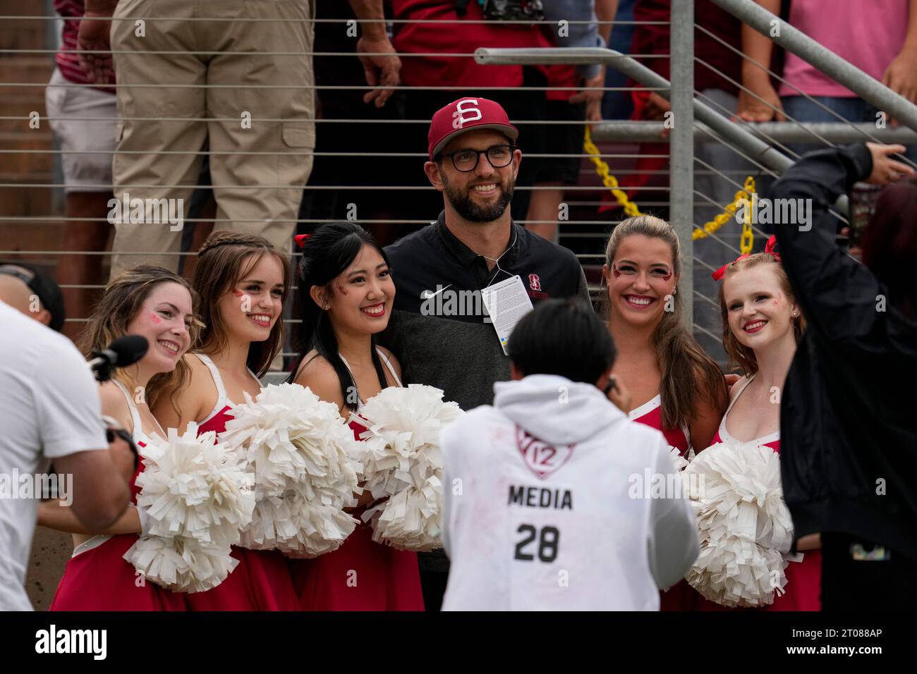 Former Stanford and Indianapolis Colts quarterback Andrew Luck, center